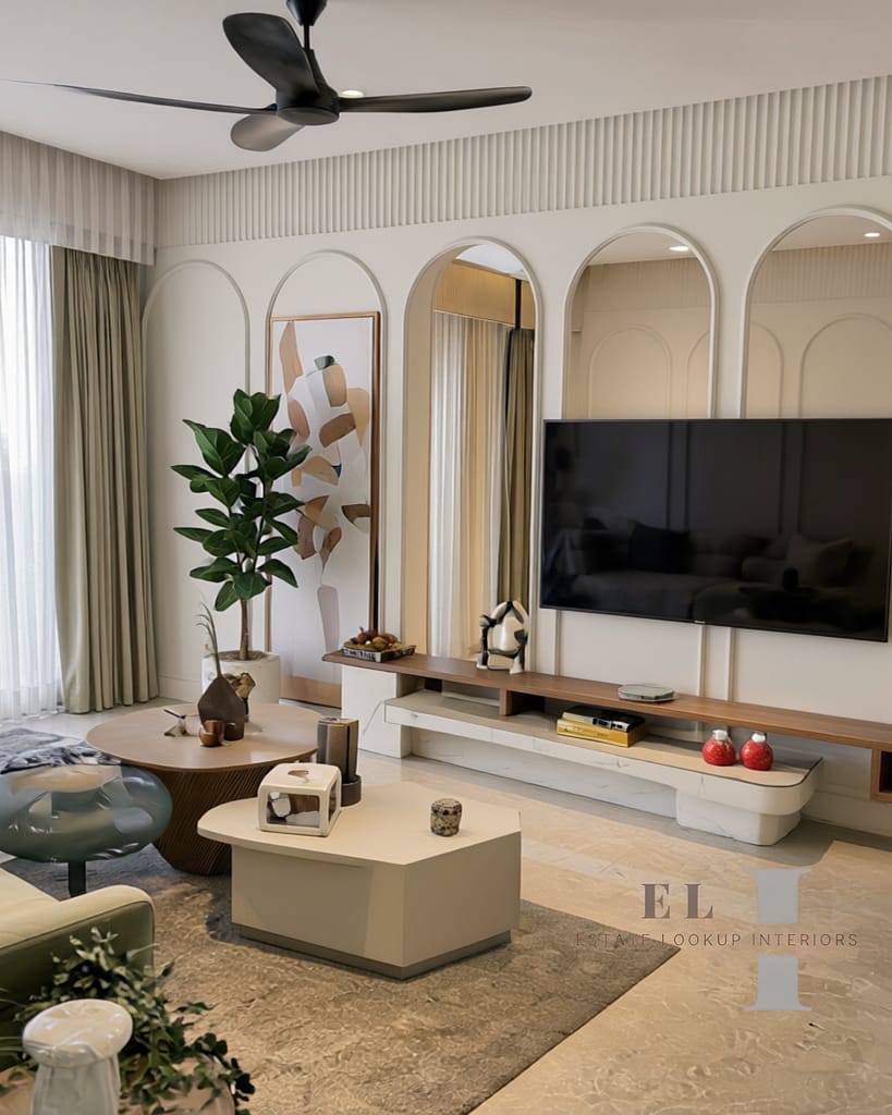 A Calm, Modern 3BHK Living Room in Kolkata 6 Living room TV unit with arched mirror niches and wooden floating console in a 3BHK Kolkata flat